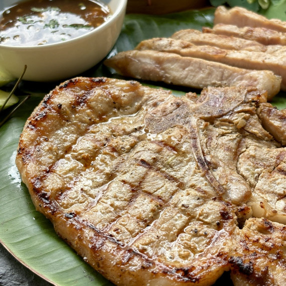 Thai pork chops with dipping sauce.