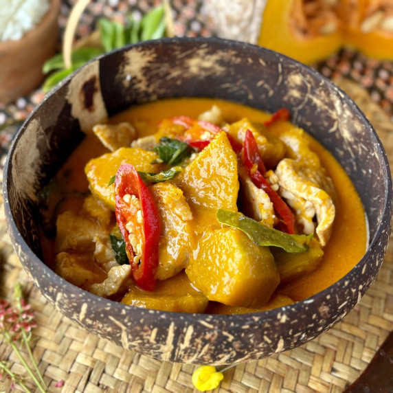 Thai pumpkin curry with pork, chilies, pumpkin chunks, and sweet basil.