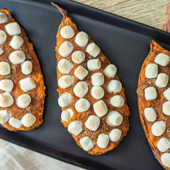 Twice baked sweet potato casseroles topped with cinnamon sugar and mini marshmallows