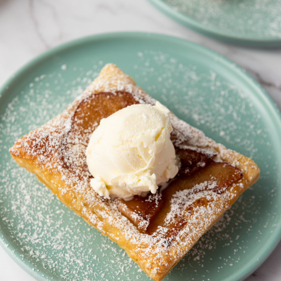 Upside Down Puff Pastry Tart with Cosmic Crisp Apples on a plate