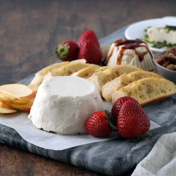 vegan goat cheese with bread and strawberries