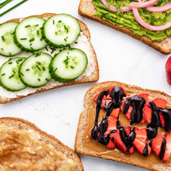 Four different vegan toast ideas with cucumber, chocolate, mashed banana, and avocado.