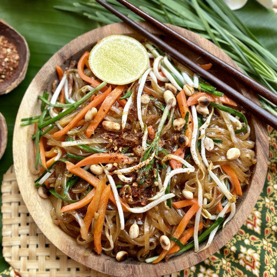 Vegetarian pad Thai vegetables served in a wooden dish.